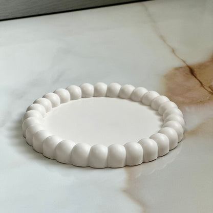 Halo decorative tray – smooth white finish styled on marble